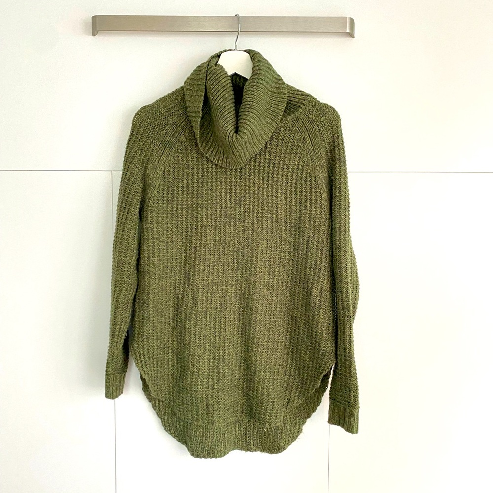 Green chunky cable-knit sweater
